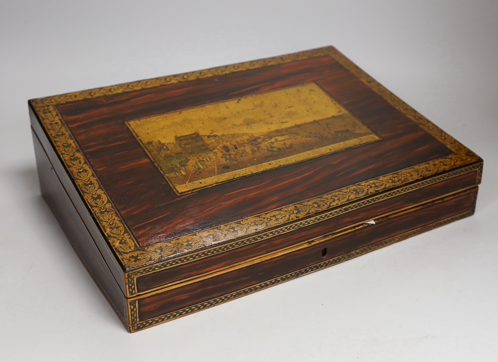 An early Tunbridge ware writing slope decorated with a scene of Brighton seafront and chain-pier to the cover. 36cm wide